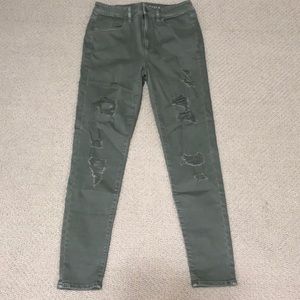 Olive colored ripped jeans